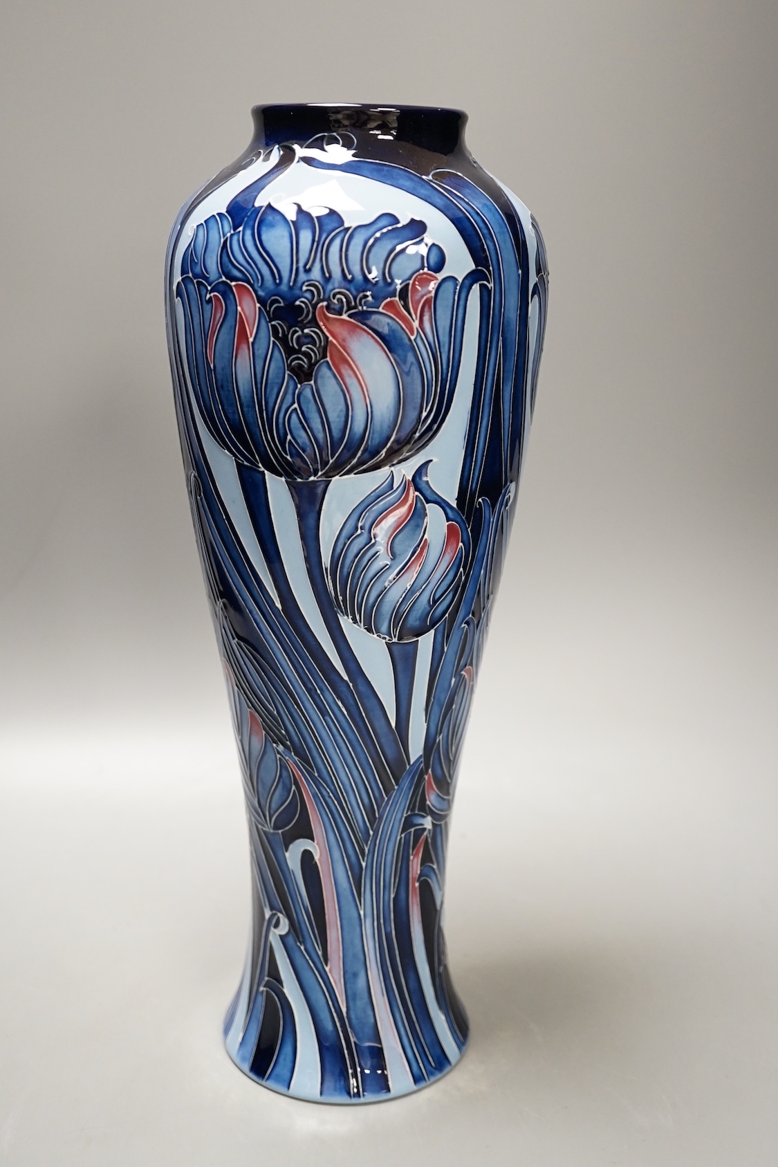 A Moorcroft 'blue tulip' vase, 2013, limited edition, 41/50, boxed, 37 cms high.